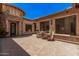 Charming courtyard with seating area, showcasing an elegant stone design and inviting ambiance at 24348 S 201St Ct, Queen Creek, AZ 85142