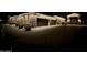 Stunning stone home with attached garage and driveway, illuminated by roofline Christmas lights at 24348 S 201St Ct, Queen Creek, AZ 85142