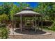 Charming backyard gazebo featuring comfortable seating and a decorative table at 24348 S 201St Ct, Queen Creek, AZ 85142