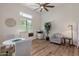 Open office with a chess table, a printer, and large windows with natural light at 24348 S 201St Ct, Queen Creek, AZ 85142