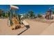 Community playground with slides, climbing structures, and a nearby splash pad at 24348 S 201St Ct, Queen Creek, AZ 85142