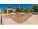 Community splash pad with decorative water features and a covered seating area at 24348 S 201St Ct, Queen Creek, AZ 85142