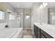 The bright primary bath features a separate shower, soaking tub, and a dual sink vanity with modern fixtures at 2741 S Gordon --, Mesa, AZ 85209