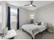 Cozy bedroom with ceiling fan, neutral colors, and modern decor for a peaceful retreat at 2741 S Gordon --, Mesa, AZ 85209