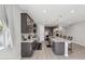 Open kitchen boasts an oversized island, granite countertops, stainless appliances and modern lighting at 2741 S Gordon --, Mesa, AZ 85209