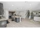 Open kitchen boasts an oversized island, granite countertops, stainless appliances and modern lighting at 2741 S Gordon --, Mesa, AZ 85209