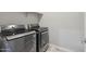 Modern laundry room featuring side-by-side stainless steel washer and dryer at 2741 S Gordon --, Mesa, AZ 85209