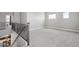 Spacious loft with iron-wrought railing and neutral carpet; access to other rooms at 2741 S Gordon --, Mesa, AZ 85209