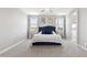 This stylish main bedroom offers great natural light with a plush bed and neutral decor throughout at 2741 S Gordon --, Mesa, AZ 85209
