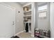 Well-lit mud room with built-in shelving, coat hooks, and shoe storage near the entrance at 2741 S Gordon --, Mesa, AZ 85209