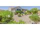 Charming backyard featuring desert landscaping and a covered patio perfect for outdoor living at 27413 W Tonopah Dr, Buckeye, AZ 85396