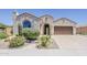 Charming single-story home boasting a stucco exterior, desert landscaping, and a tile roof at 27413 W Tonopah Dr, Buckeye, AZ 85396