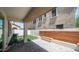 Covered patio with views of the outdoor space, including an artificial lawn and built-in bench at 31653 N 24Th Dr, Phoenix, AZ 85085