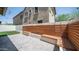An inviting backyard featuring a built-in bench, patio, artificial turf, and string lights at 31653 N 24Th Dr, Phoenix, AZ 85085
