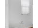 Bright bathroom toilet area with a window at 31653 N 24Th Dr, Phoenix, AZ 85085