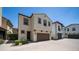 Charming two-story home with a brown two-car garage, paver driveway and minimal landscaping at 31653 N 24Th Dr, Phoenix, AZ 85085