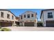 Charming two-story home with a brown two-car garage, paver driveway and manicured landscaping at 31653 N 24Th Dr, Phoenix, AZ 85085