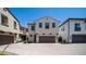 Charming two-story home with a brown two-car garage, paver driveway and manicured landscaping at 31653 N 24Th Dr, Phoenix, AZ 85085