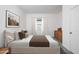 Comfortable bedroom with a large bed, soft lighting, and neutral decor at 32218 N Knauss Ln, San Tan Valley, AZ 85143