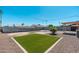 Large backyard with desert rockscape, privacy wall, and a built-in firepit at 3231 W Banff Ln, Phoenix, AZ 85053