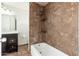 Updated bathroom with tiled shower-bath and dark wood vanity at 3231 W Banff Ln, Phoenix, AZ 85053