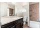 Updated bathroom with large vanity and tiled shower and tub at 3231 W Banff Ln, Phoenix, AZ 85053