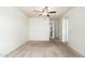 Neutral carpet in a bedroom with an ensuite bathroom, perfect for relaxing at 3231 W Banff Ln, Phoenix, AZ 85053