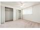 Bedroom with two large, mirrored closets and natural light at 3231 W Banff Ln, Phoenix, AZ 85053