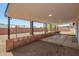 A concrete block back porch faces a sand lot at 3302 N 40Th Dr, Phoenix, AZ 85019