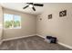 Carpeted bedroom with window and decorative pillows at 3302 N 40Th Dr, Phoenix, AZ 85019