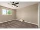 Comfortable bedroom featuring neutral tones, carpeted floors and a ceiling fan at 3302 N 40Th Dr, Phoenix, AZ 85019