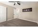 This is a standard bedroom with carpet, closet and ceiling fan at 3302 N 40Th Dr, Phoenix, AZ 85019