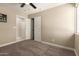 The room is carpeted and has white trim and doors at 3302 N 40Th Dr, Phoenix, AZ 85019