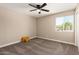 Inviting bedroom featuring a large window with a view and plush carpet flooring at 3302 N 40Th Dr, Phoenix, AZ 85019