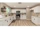 Modern kitchen with white cabinetry, stainless steel appliances, and bright lighting at 3302 N 40Th Dr, Phoenix, AZ 85019