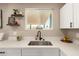 Modern kitchen sink with stainless steel fixtures and ample counter space at 3302 N 40Th Dr, Phoenix, AZ 85019