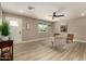 Bright and inviting living room with modern decor, wood flooring, ceiling fan, and neutral color palette at 3302 N 40Th Dr, Phoenix, AZ 85019