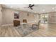 Spacious open-concept living room featuring wood floors, modern decor, and an abundance of natural light at 3302 N 40Th Dr, Phoenix, AZ 85019
