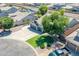 Aerial perspective of a home with a manicured lawn and view of community amenities at 34970 N Spur Cir, San Tan Valley, AZ 85144