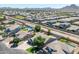 Wide aerial shot of a residential area, highlighting the neighborhood layout, and proximity to local amenities at 34970 N Spur Cir, San Tan Valley, AZ 85144