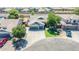 Overhead shot showcasing a single-Gathering home with a spacious three-car garage and a neatly landscaped front yard at 34970 N Spur Cir, San Tan Valley, AZ 85144