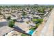 High-angle aerial view capturing a sprawling residential community with lush greenery and well-spaced homes at 34970 N Spur Cir, San Tan Valley, AZ 85144