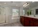 Bathroom featuring a large soaking tub, a shower and and sinks at 34970 N Spur Cir, San Tan Valley, AZ 85144