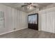 Bedroom with hidden Murphy bed, closet, wood look flooring, and ceiling fan at 34970 N Spur Cir, San Tan Valley, AZ 85144