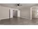 Large primary bedroom features wood-look tile flooring, neutral paint, and a ceiling fan at 34970 N Spur Cir, San Tan Valley, AZ 85144