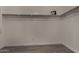 Walk in closet featuring wood rods and white walls at 34970 N Spur Cir, San Tan Valley, AZ 85144