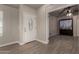 Inviting entryway with a decorative glass front door and neutral-toned flooring, flowing into adjacent living space at 34970 N Spur Cir, San Tan Valley, AZ 85144