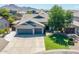 Charming single-Gathering home with a three-car garage and well-maintained lawn at 34970 N Spur Cir, San Tan Valley, AZ 85144