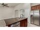 This kitchen island features a dual sink, stainless steel dishwasher, and granite countertops at 34970 N Spur Cir, San Tan Valley, AZ 85144