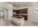 Gorgeous kitchen features stainless appliances, dark granite counters, and a kitchen island at 34970 N Spur Cir, San Tan Valley, AZ 85144